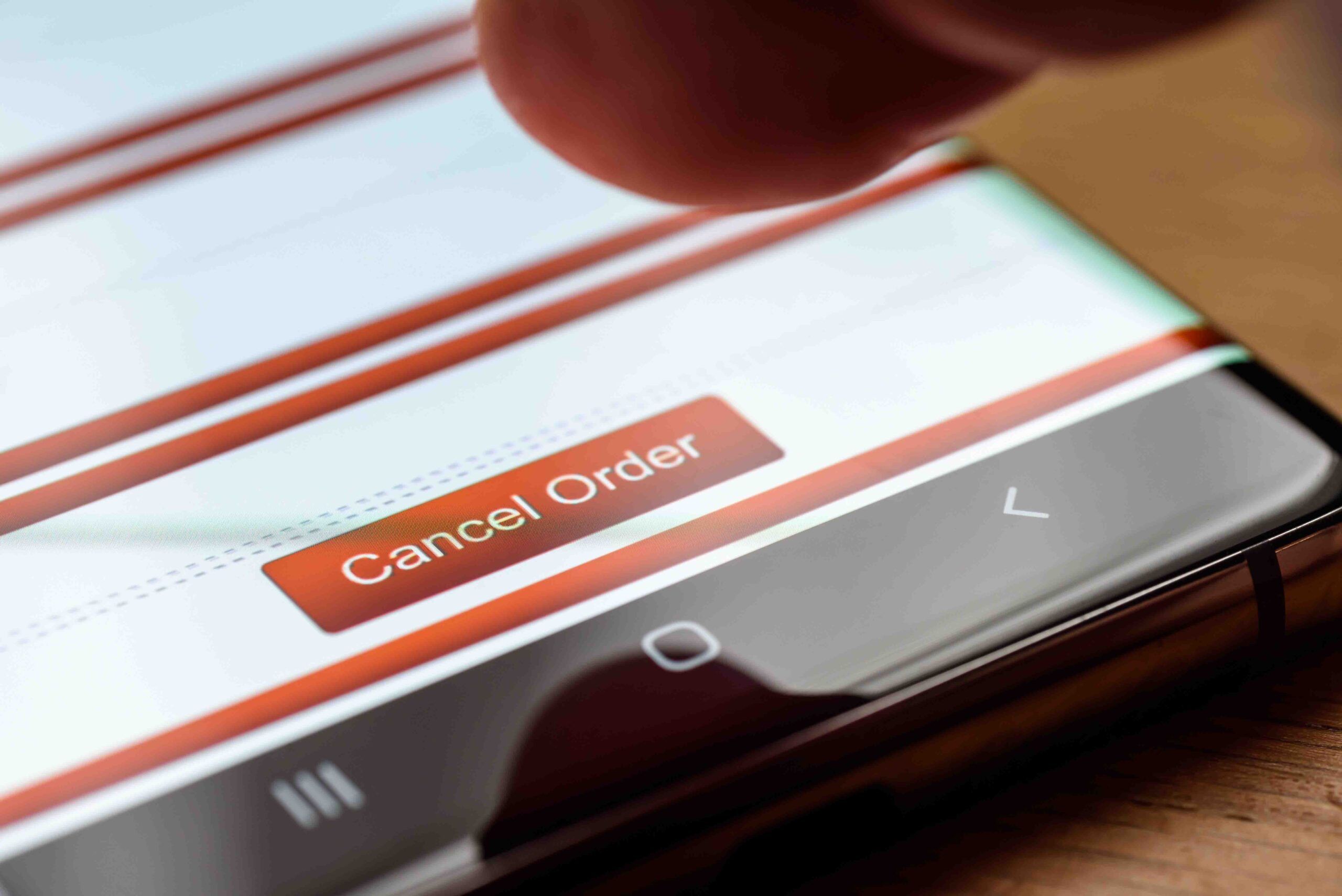 cancel order text button on smart phone screen AdobeStock 327559992 scaled